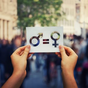 Person holding gender equality sign