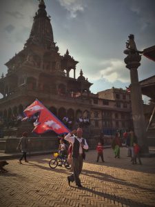 Nepal_Rachel H_man with flag
